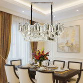 Candelabru modern lux oval cu cristale pe niveluri, finisaj argintiu si 12 E27, ideal pentru zona de dining moderna si sofisticata, model 78012-1100×400 CH.