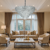 Candelabru rotund din cristal argintiu Ø800 mm, cu 16 surse E27, montat intr-un living cu tavan inalt si efect luxos