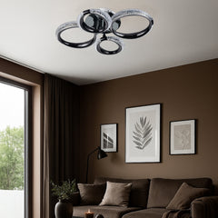 Lustra LED P011-2+2 cu patru cercuri decorative si finisaj negru lucios, lumina reglabila si telecomanda, iluminand un living modern.