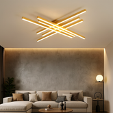 Lustra LED 9795/6FG aurie cu 6 brate incrucisate si telecomanda, montata in living modern cu iluminare reglabila.