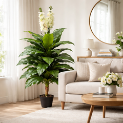 Copac artificial cu zambile mov 150 cm in ghiveci decorativ, amplasat in living modern langa canapea, aspect bogat si realist
