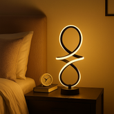 Veioza LED negru mat forma infinity 46W cu lumina calda, neutra sau rece creeaza o atmosfera relaxanta perfecta pentru dormitoare moderne.