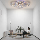 Lustra LED 328W cu 8 inele si cristal, lumina RGB si reglaj 3500K-6500K cu telecomanda, montata in living modern pentru iluminare eleganta