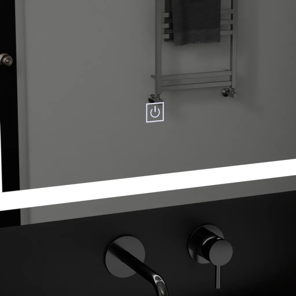 Oglinda LED 50x70 cm cu touch si contur luminos rece, design modern pentru baie si spatii contemporane.
