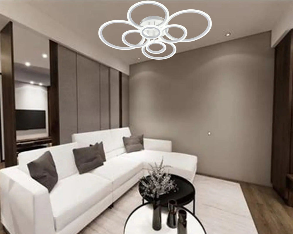 Lustra LED alba opt cercuri 180W cu telecomanda, montata in living mare modern, lumina ajustabila 3000-6500K pentru iluminare eleganta si puternica