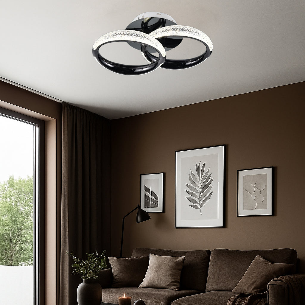 Lustra LED P011-2 cu doua cercuri suprapuse si cristale, lumina reglabila si telecomanda, iluminand elegant un living modern.
