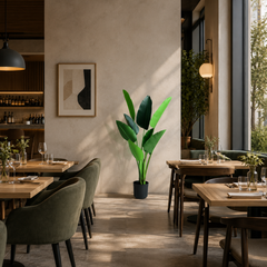 Plantă artificială Strelitzia Nicolai verde, 120 cm, cu frunze tropicale mari și aspect realist, în ghiveci negru, ideală pentru living, dormitor, birou, recepție, hotel, restaurant, cafenea și spații comerciale.