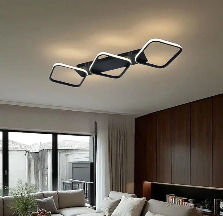 Lustra LED 77206/3 MB cu design modern metalic si lumina reglabila, montata intr-un living contemporan pentru iluminare clara si eleganta.
